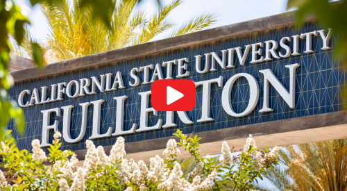 Cal state fullerton marquee behind flowers with red and white play button on top